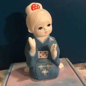 Blue Ceramic Figurine with Red Accents